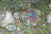 Kangra Valley - carved stones along the ritual path that encircle the Tsuglagkhang, official residence of the Dalai Lama